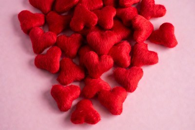 Red heart shapes on pink surface