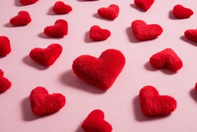 Soft red hearts on pink background