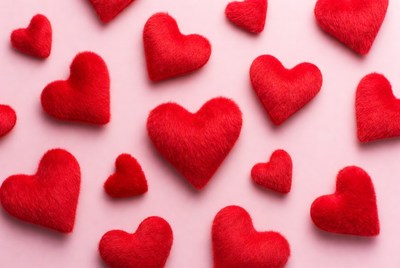 Red hearts on pink background