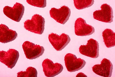 Red hearts on pink background for decoration