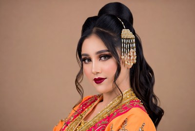 Woman in traditional dress poses for portrait