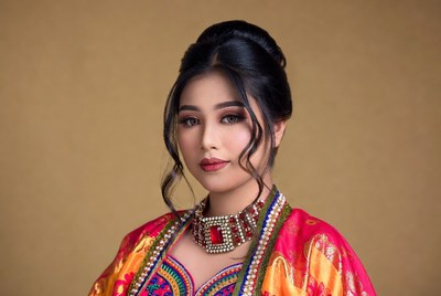 Woman in traditional dress poses