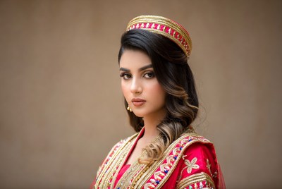 Woman in traditional dress poses