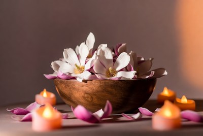 Bowl of flowers with candles lit