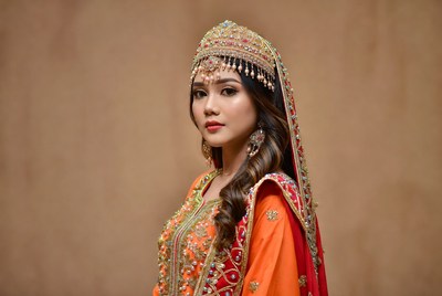 Woman in traditional dress poses for camera