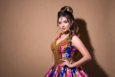 Traditional dress worn by model indoors