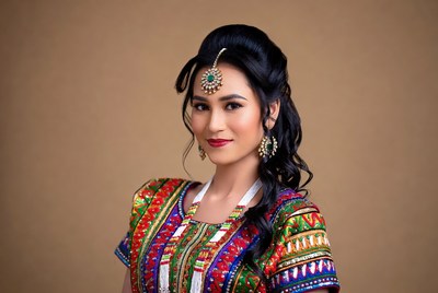 Woman in traditional dress poses for portrait