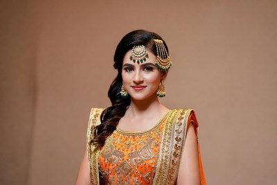 Woman in traditional dress poses for camera