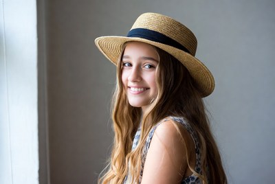 Girl smiling with straw hat