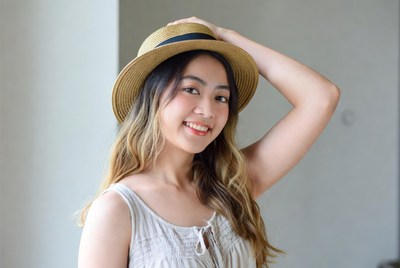 Young woman wearing a hat indoors