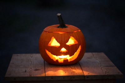 Lantern on wooden table at night