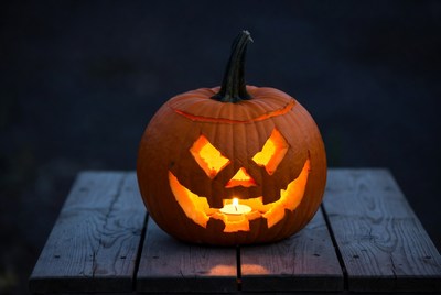 Pumpkin with candle at night