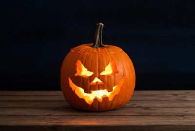 Pumpkin with carved face at night