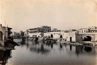Old bridge over river in city