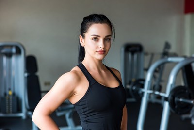 Woman posing in gym setting
