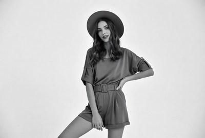 Model poses in stylish outfit