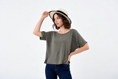 Woman wearing hat and shirt indoors