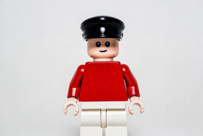 Lego figure standing with black hat
