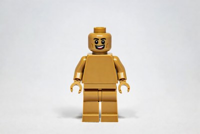 Gold lego figure stands alone