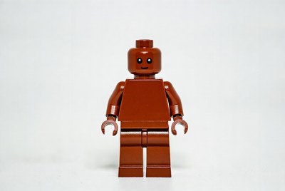 Brown brick figure stands alone