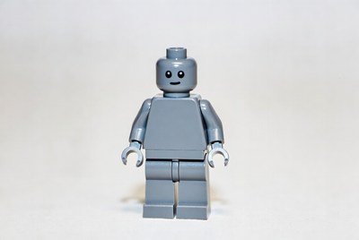 Gray robot figure on plain background