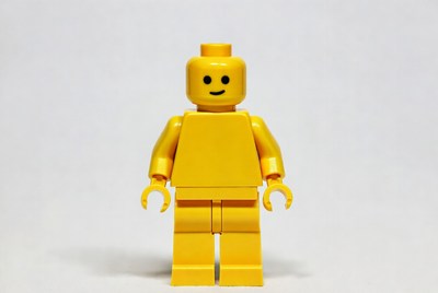 Bright yellow toy figure stands upright