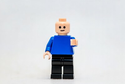 Lego figure holding cup in studio