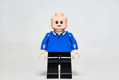 Lego figure in blue shirt and black pants