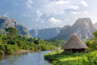 Hut by the river and mountains