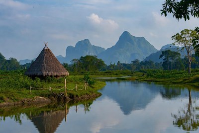 Hut by the river in the mountains