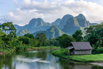 Mountains and hut by the river