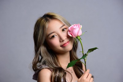 Young woman holding a rose