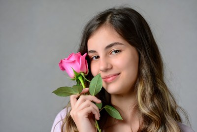 Girl with a pink rose