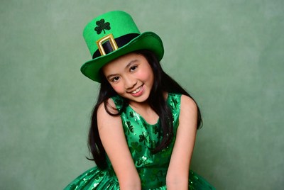 Girl in green hat smiling