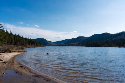 Lake scene in mountain area with trees
