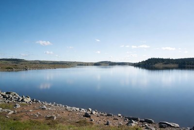 Calm lake under clear sky