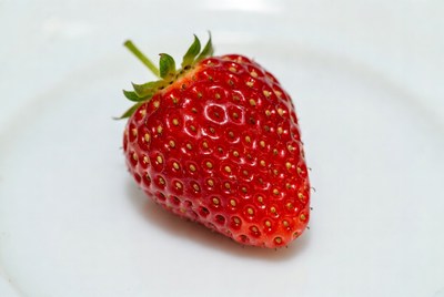 Fresh strawberry on white plate