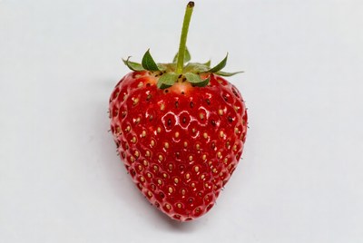 Fresh strawberry on white surface