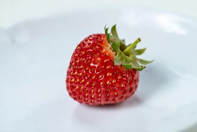Fresh strawberry on white plate