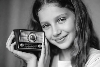 Girl holding a radio in black and white