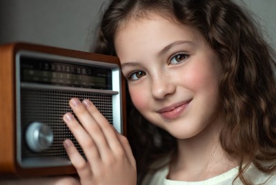 Girl listening to radio at home