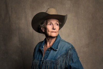 Elderly woman wearing cowboy hat