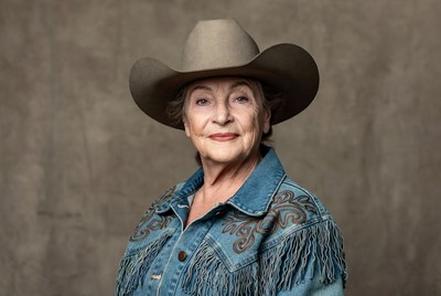 Senior woman wears cowboy hat