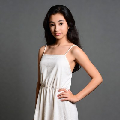 Young girl poses in studio setting