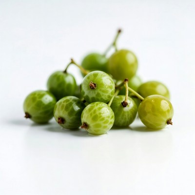 Fresh green fruits on white surface