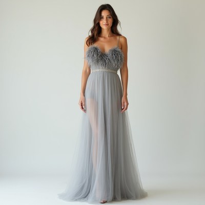 Woman in gray dress with feathers