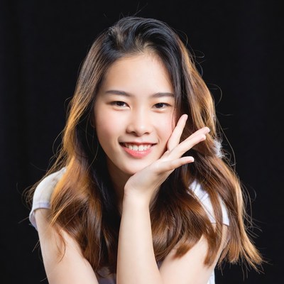 Young woman smiling with hand on face