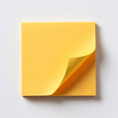 Yellow sticky note on a white surface