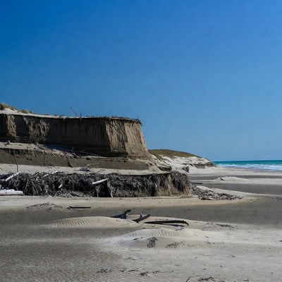Sand erosion on beach shoreline
