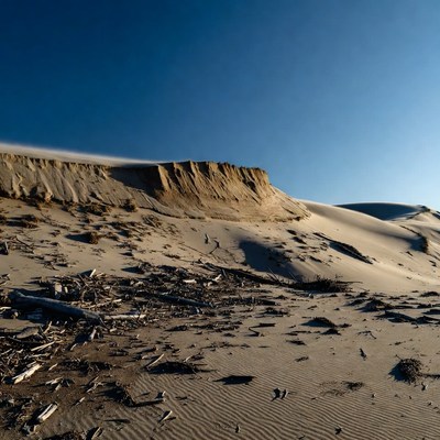 Stretched sand at sunset near cliffs